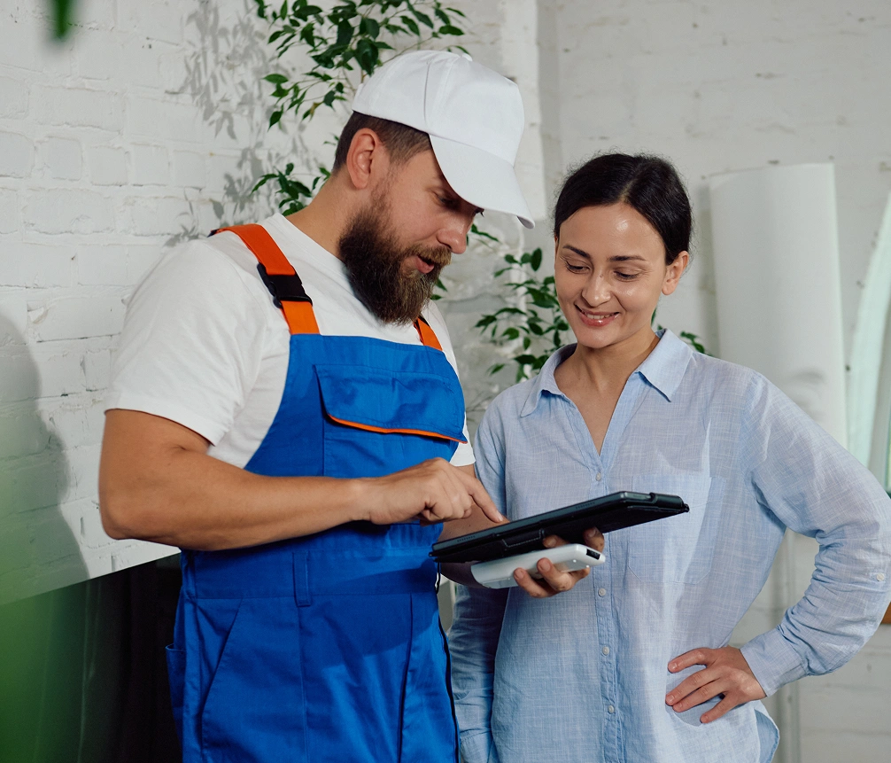 Contractor showing client details on tablet